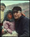 Image of MacMillan and Eskimo child, mother beyond